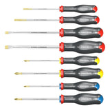 Jeu de tournevis Facom, outillage à manche noir et embouts dorés, couleurs rouge, jaune et bleu.