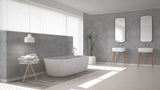 Salle de bain moderne avec béton ciré Mat Perle Vipanel, murs gris clair, baignoire design.